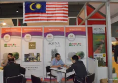 Representatives of Melon Master Sdn.Bhd are receiving visitors at the booth.